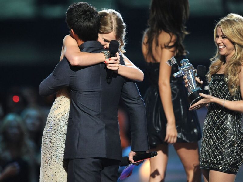 Taylor Swift with ex-boyfriend Taylor Lautner on stage during Eras Tour
